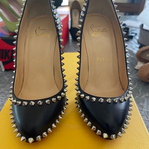 Christian Louboutin Black leather spiked Pumps.